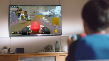 images/products/sw_switch_mario_kart_live_home_circuit_mario/__gallery/MarioKartLHC_KidPlaying.jpg